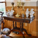 F33. Game table with twist carvings and claw feet.